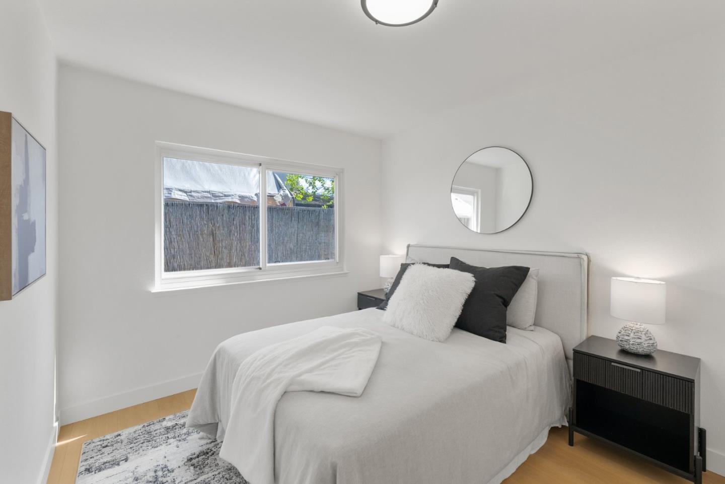 4624 Fuller Street Santa Clara, CA 95054 - Photo 18 of 26 a bedroom with a bed and a window