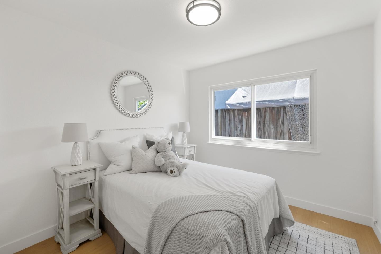 4624 Fuller Street Santa Clara, CA 95054 - Photo 19 of 26 a bedroom with a bed and window