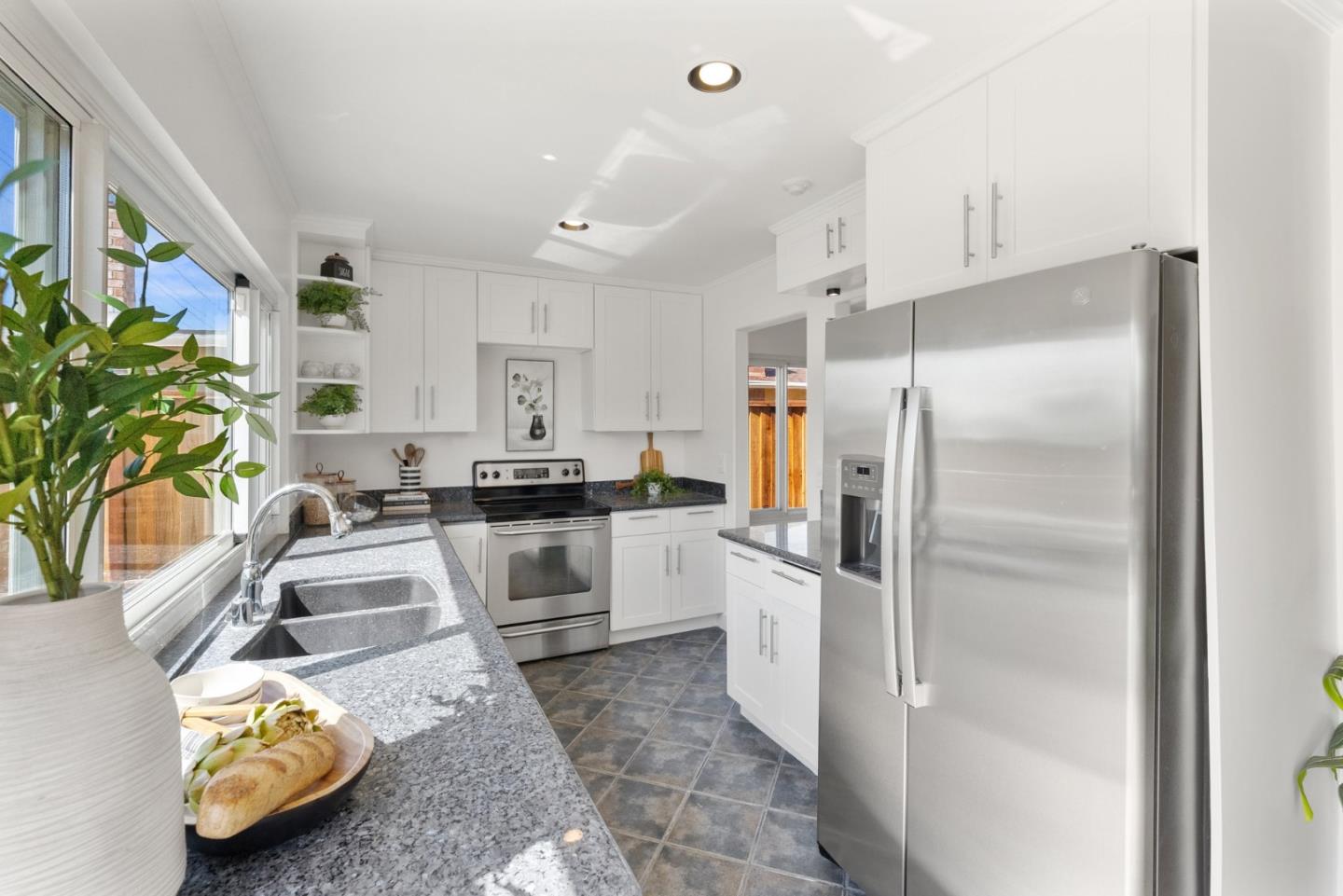 4624 Fuller Street Santa Clara, CA 95054 - Photo 6 of 26 a kitchen with granite countertop a refrigerator and a sink