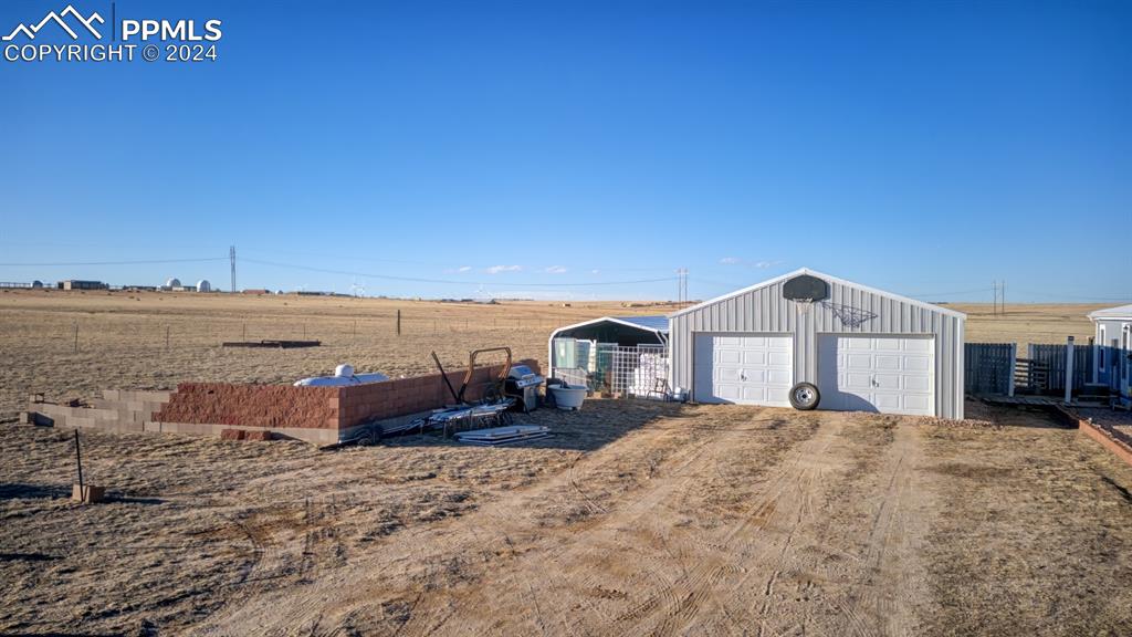 34170 Big Springs Road Yoder, CO 80864 - Photo 4 of 35 a view of a house with a yard