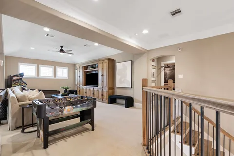 a bedroom with furniture and a wooden floor