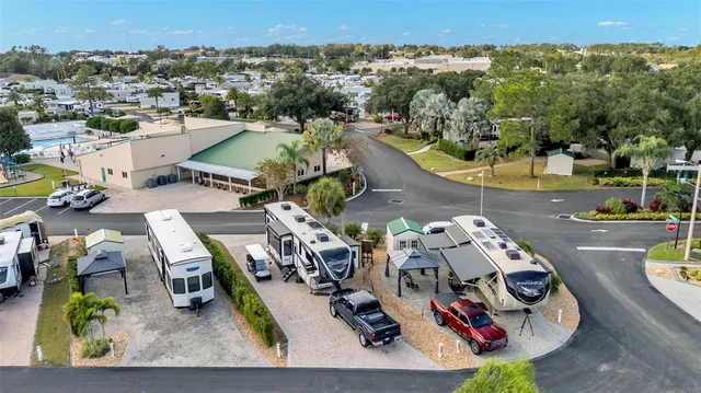 an aerial view of a house with a swimming pool yard and outdoor seating
