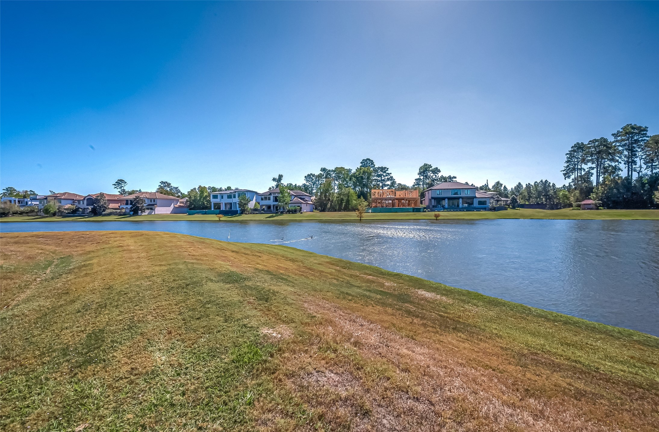39 Pronghorn Place Spring, TX 77389 - Photo 21 of 39 a view of a lake with houses