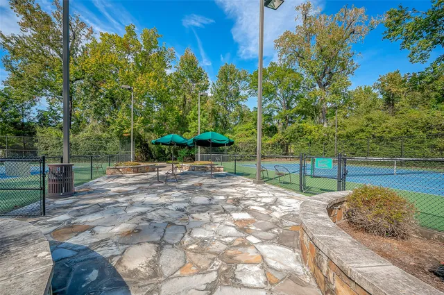 a view of a swimming pool with a yard