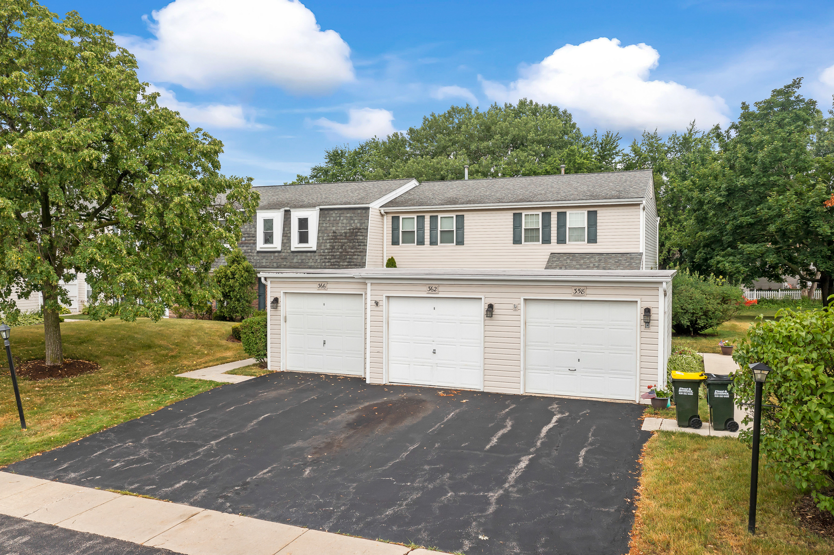 362 Rodenburg Road Roselle, IL 60172 - Photo 3 of 19 a front view of a house with a yard and garage