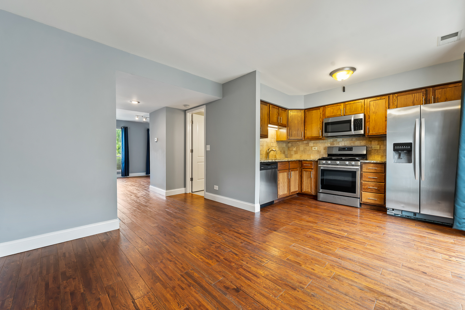 362 Rodenburg Road Roselle, IL 60172 - Photo 9 of 19 a view of kitchen with stainless steel appliances wooden floor and a window