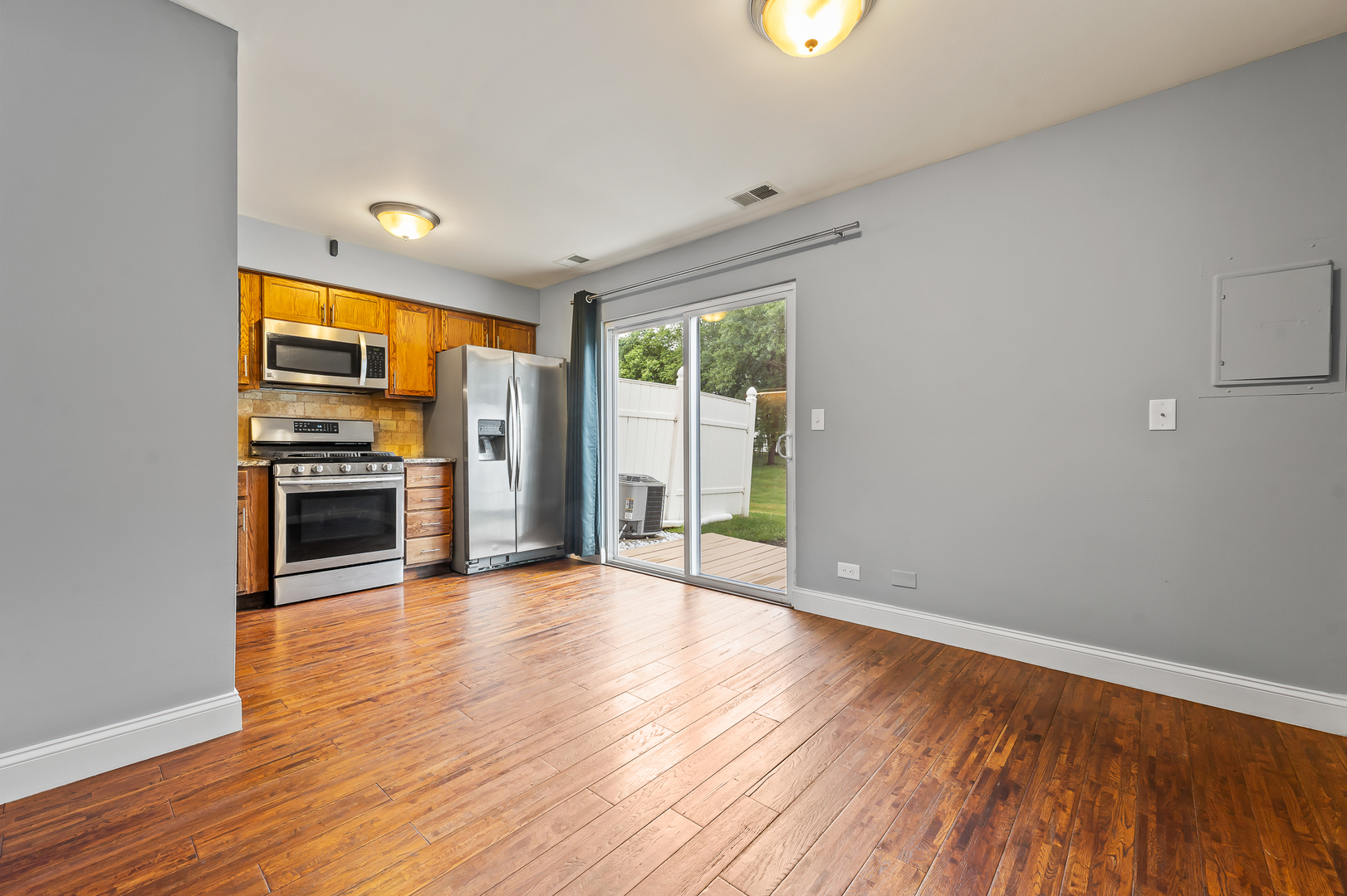 362 Rodenburg Road Roselle, IL 60172 - Photo 10 of 19 wooden floor in an empty room with a window
