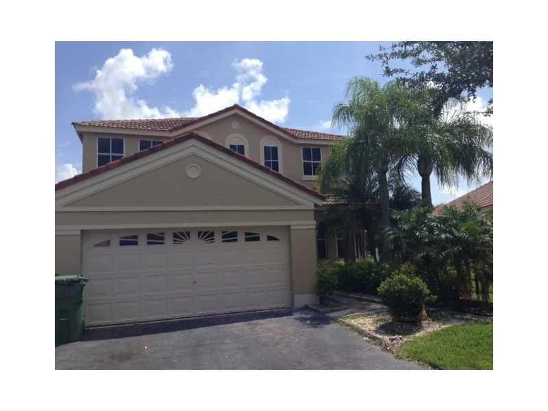 949 Falling Water Road Weston, FL 33326 - Photo 1 of 12 a view of a house with a yard