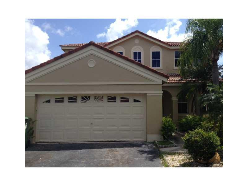 949 Falling Water Road Weston, FL 33326 - Photo 2 of 12 a view of a house with a yard
