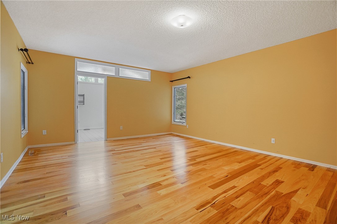 1094 San Raphael Drive Akron, OH 44333 - Photo 28 of 50 Spare room with light wood-style floors and a textured ceiling
