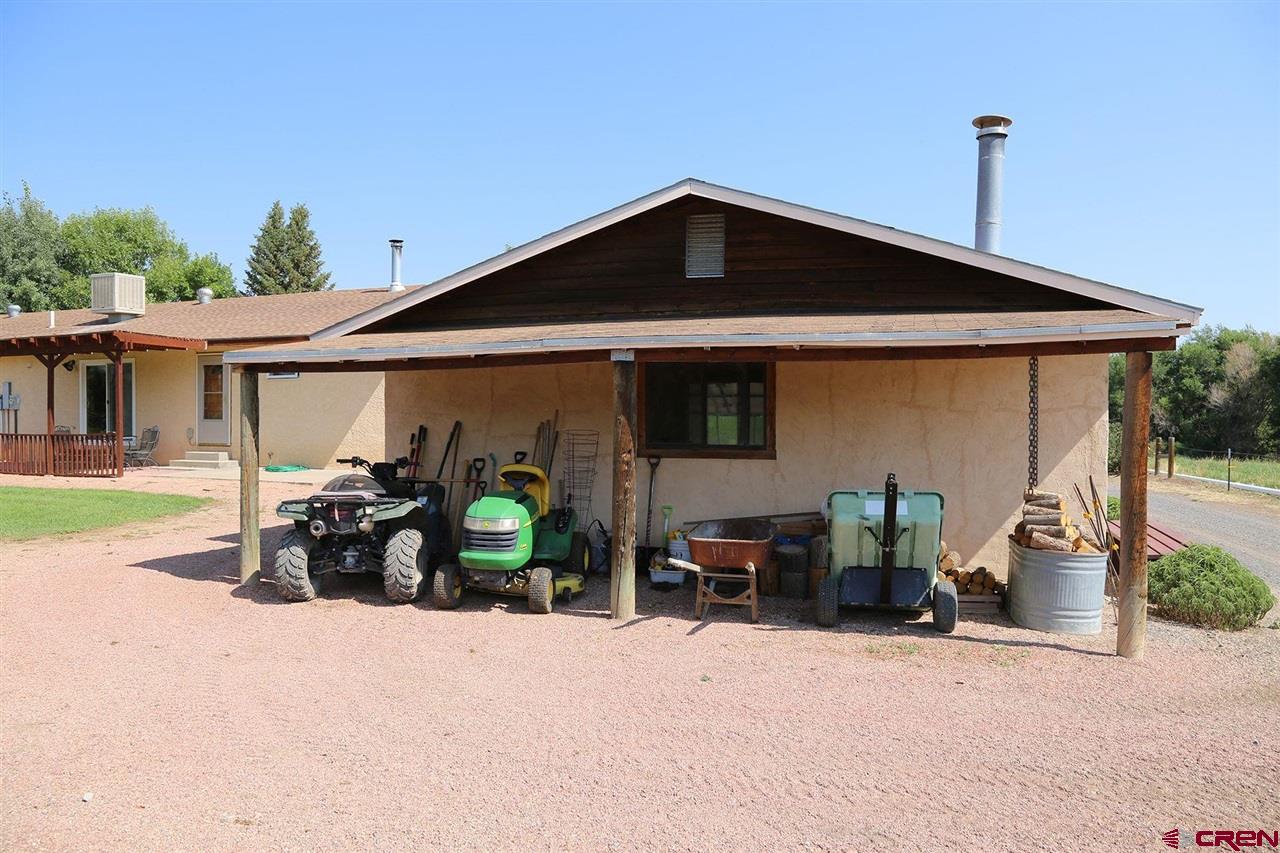 3946 1550 Road Delta, CO 81416 - Photo 22 of 35 a front view of a house with patio