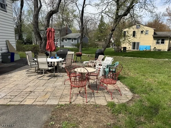 a view of a house with a yard porch and sitting area