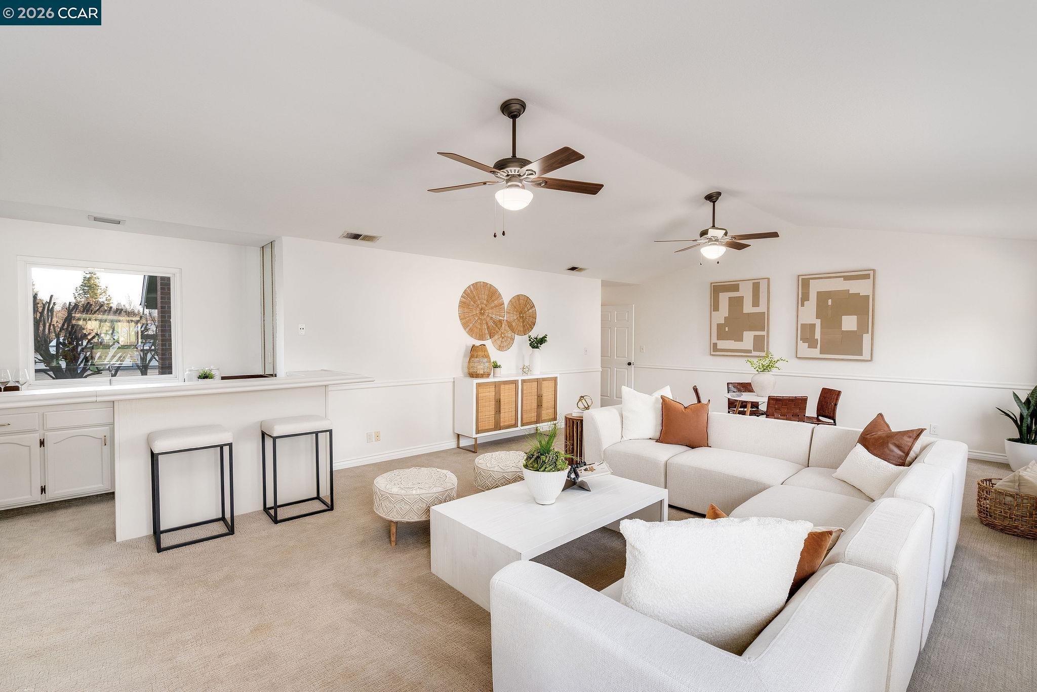 633 Lomond Circle San Ramon, CA 94583 - Photo 27 of 39 a living room with furniture a chandelier fan and a window