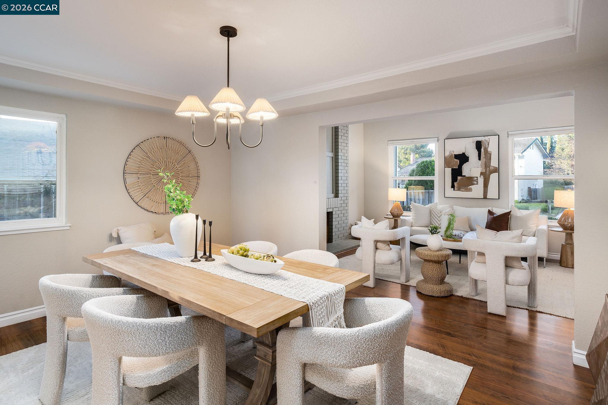 633 Lomond Circle San Ramon, CA 94583 - Photo 7 of 39 a view of a dining room with furniture a chandelier and wooden floor