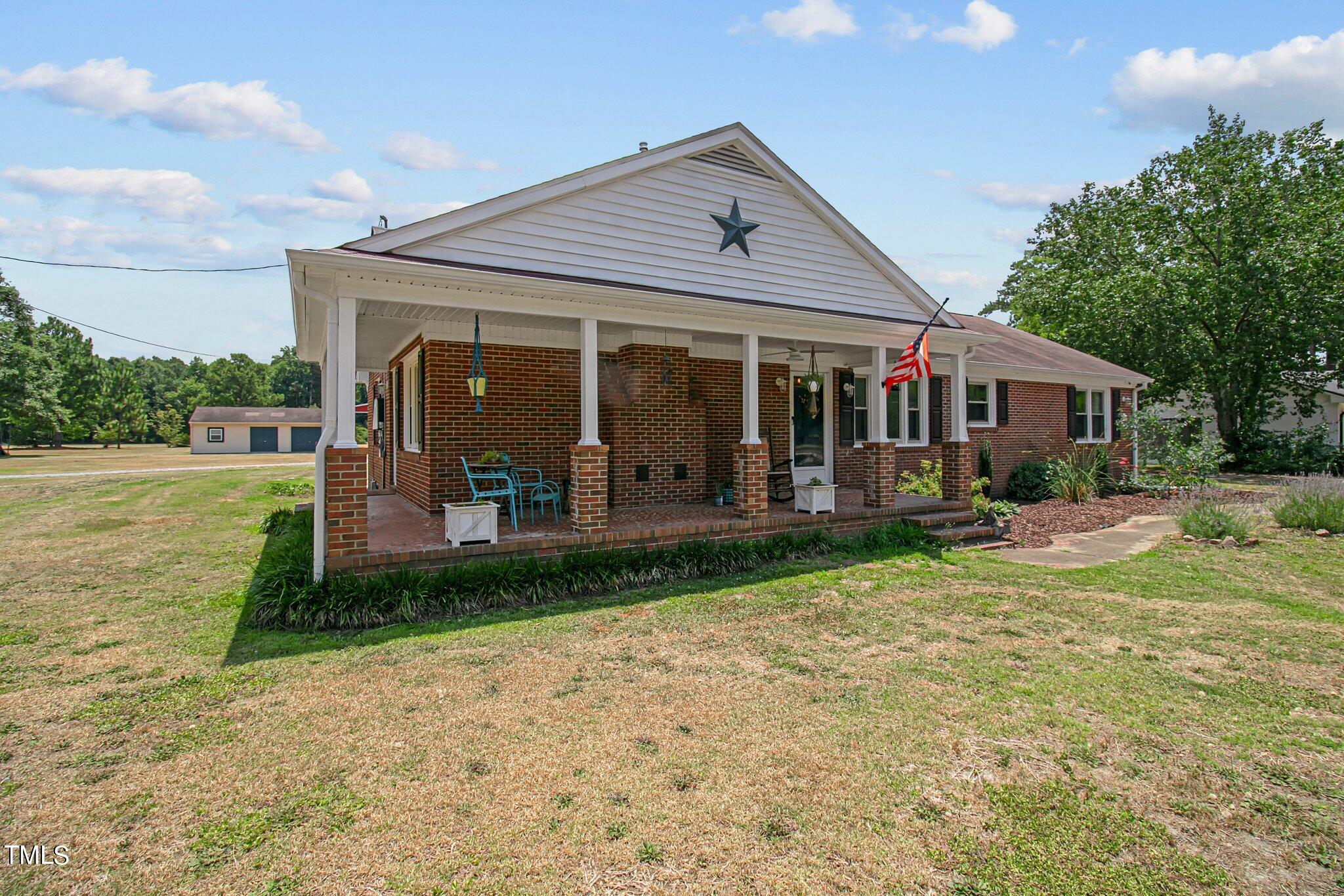 6262 Smithfield Road Wade, NC 28395 - Photo 3 of 53 a view of a house with a yard