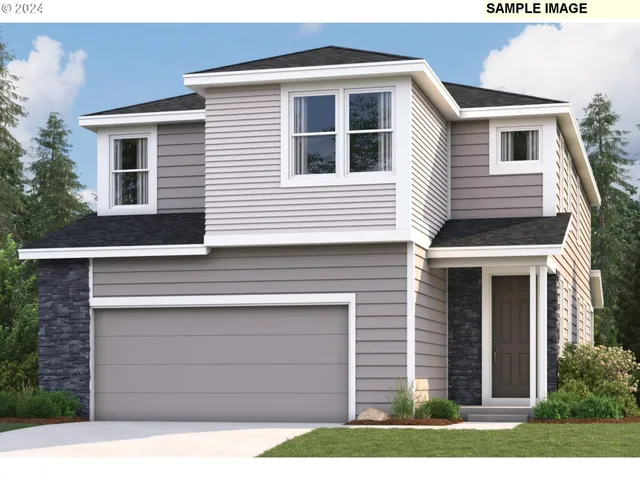 a view of a house with a yard and large tree