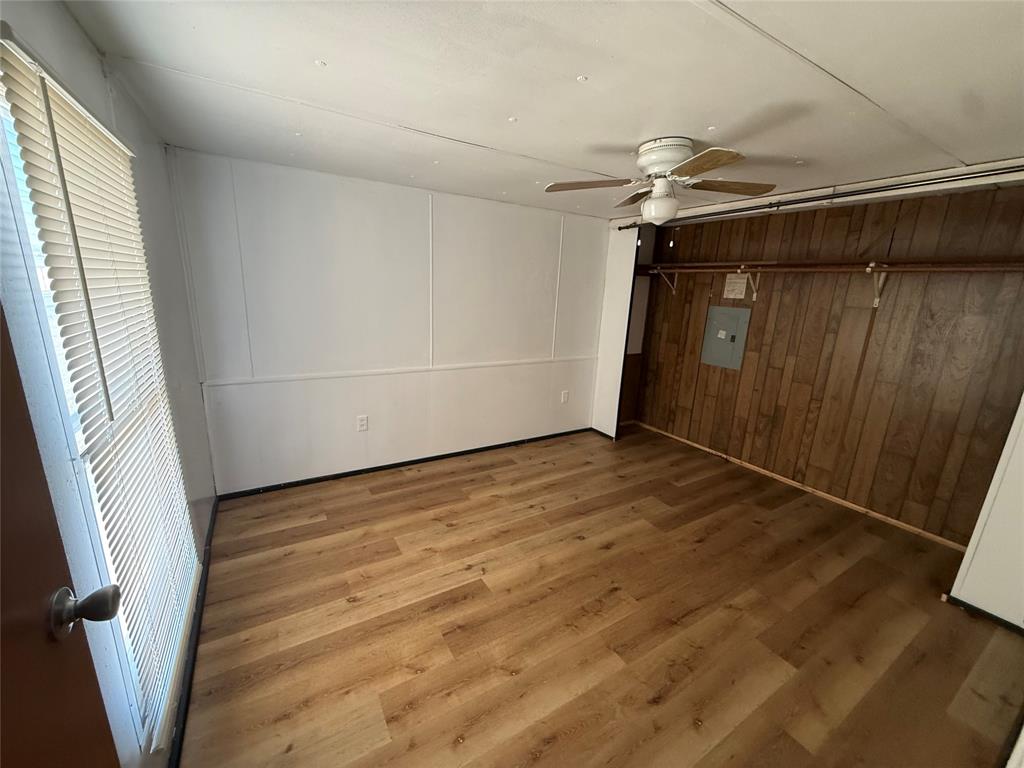3304 Hidalgo Road, Unit E Waxahachie, TX 75167 - Photo 13 of 16 a view of empty room with wooden floor and fan