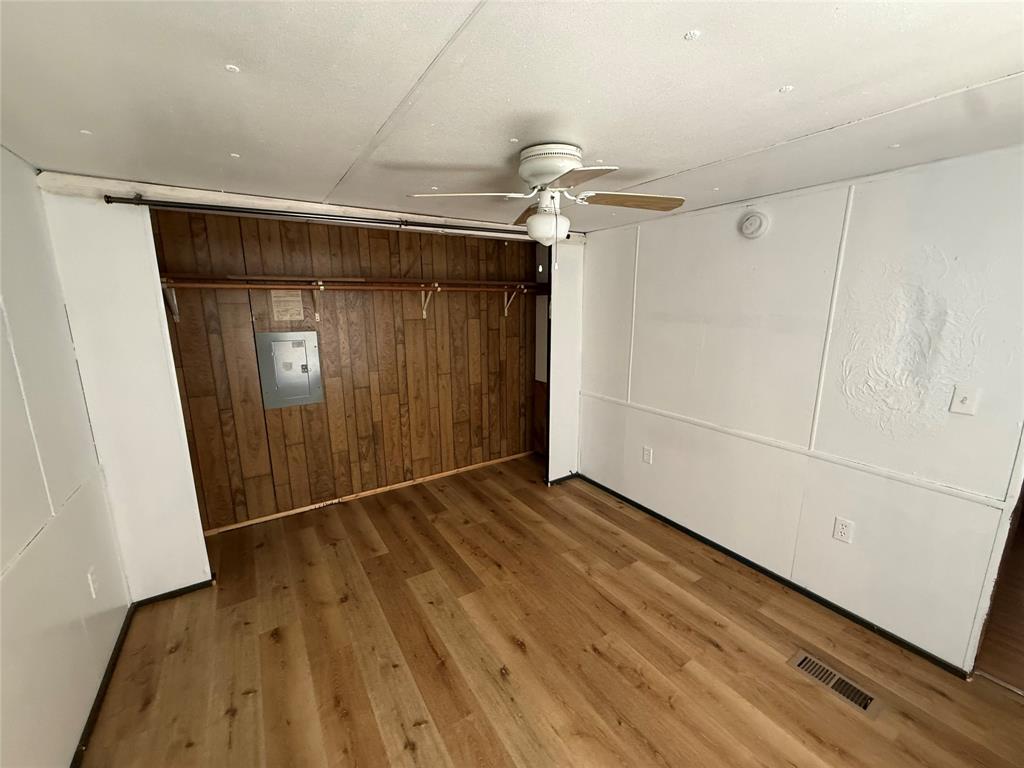 3304 Hidalgo Road, Unit E Waxahachie, TX 75167 - Photo 14 of 16 a view of an empty room with wooden floor and a window