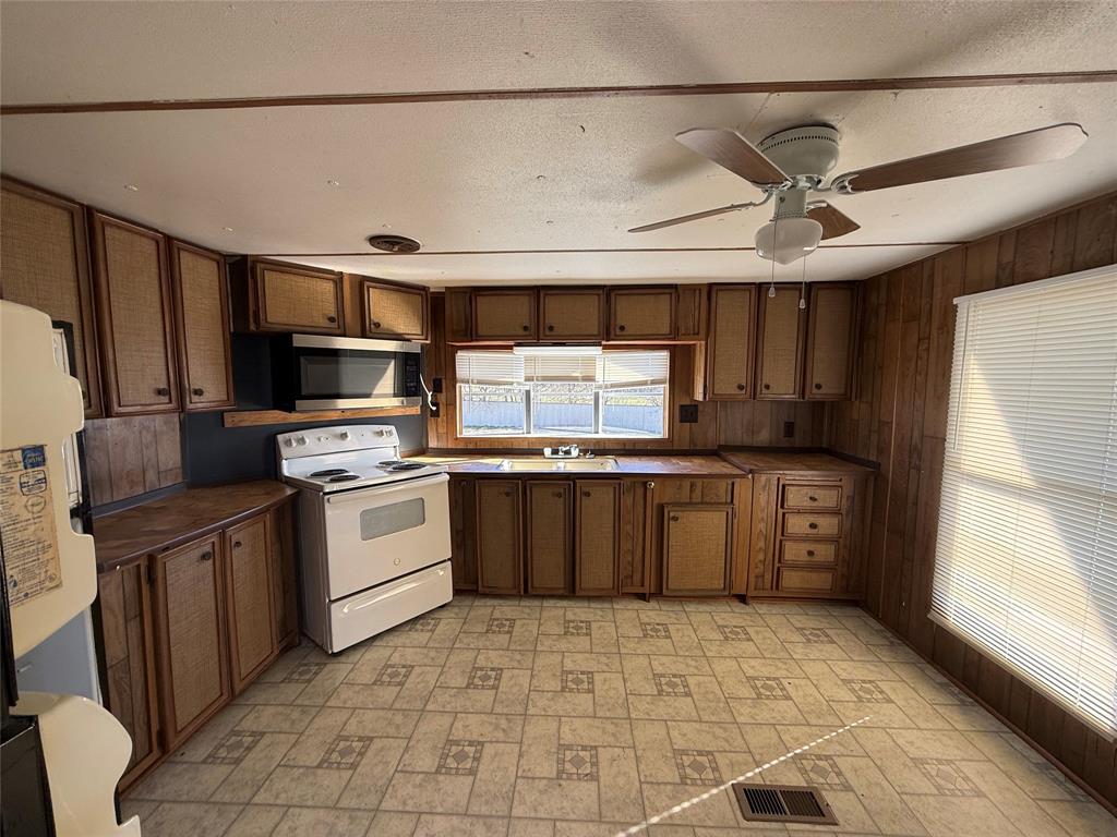 3304 Hidalgo Road, Unit E Waxahachie, TX 75167 - Photo 16 of 16 a kitchen with a sink cabinets and stainless steel appliances