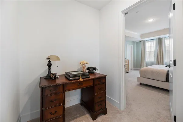 a bedroom with a bed and a table