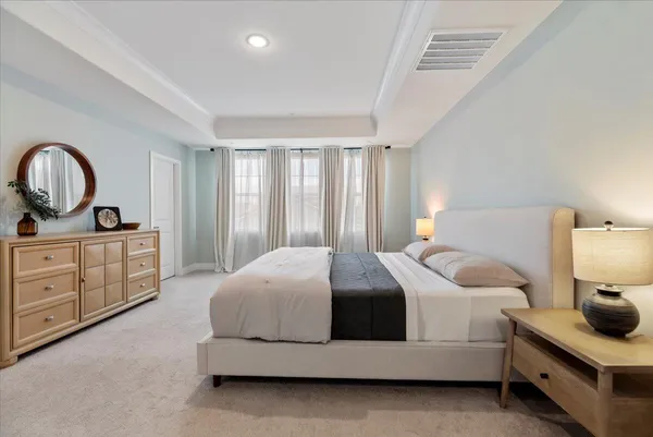 a bedroom with a bed and dresser