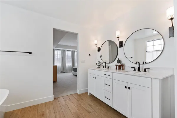 a view of a bathroom with sink and mirror