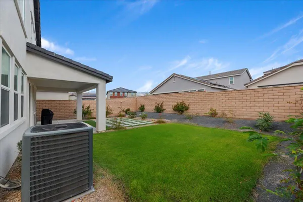 a view of a house with a backyard