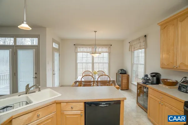 a view of a dining room with furniture and window