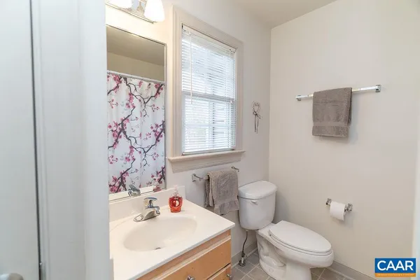 a bathroom with a sink vanity and a mirror