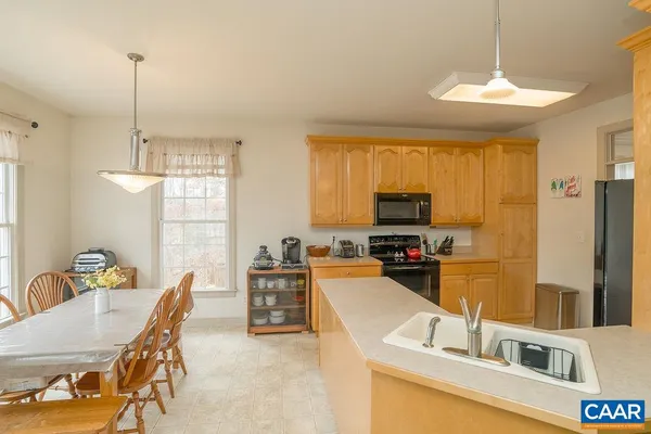 a kitchen with a sink and a stove