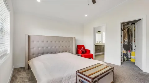 a bed room with a bed and a desk