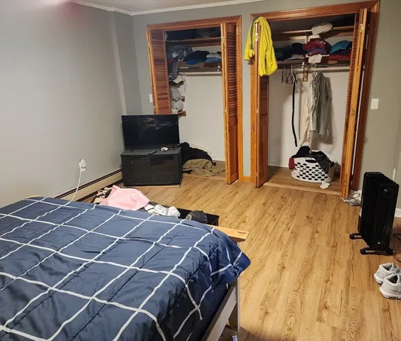 a bedroom with a bed and a cabinets