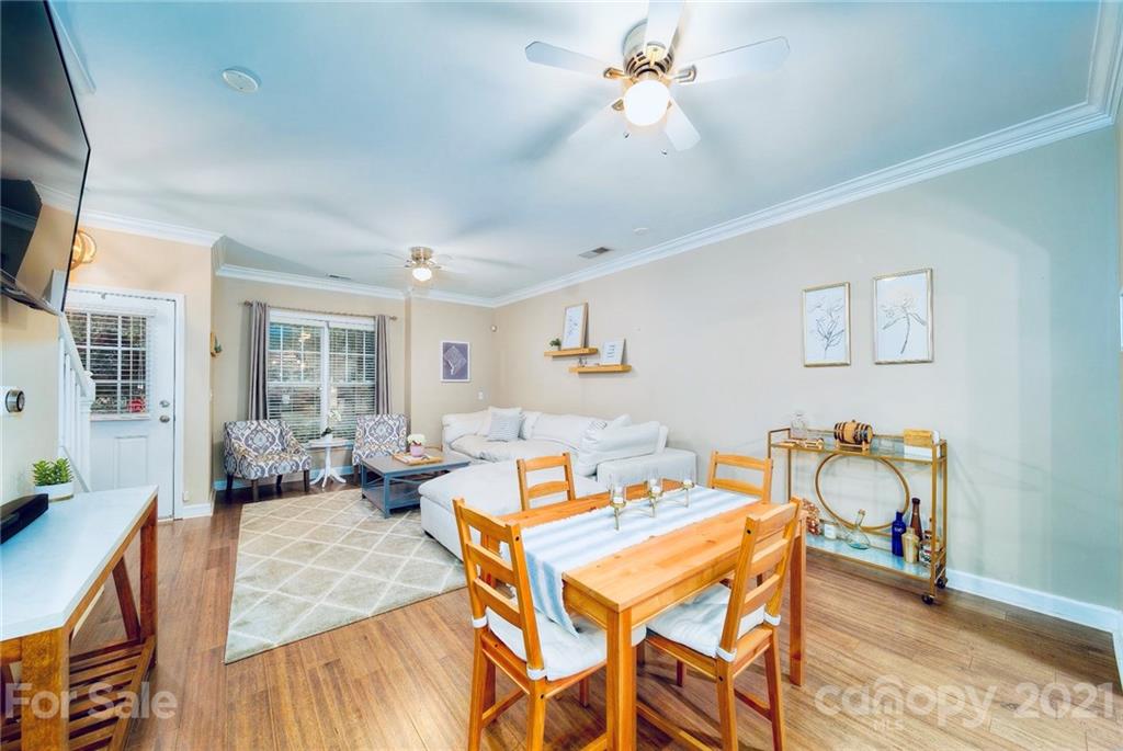 4142 Walker Road Charlotte, NC 28211 - Photo 2 of 18 a view of a dining room with furniture window and wooden floor