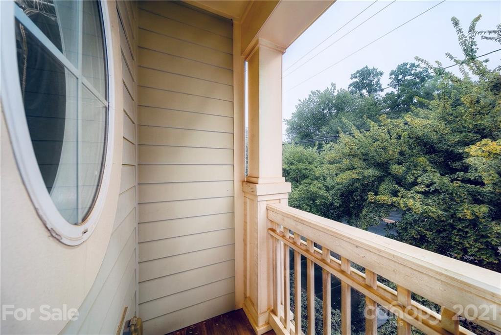 4142 Walker Road Charlotte, NC 28211 - Photo 12 of 18 a view of a balcony with wooden floor