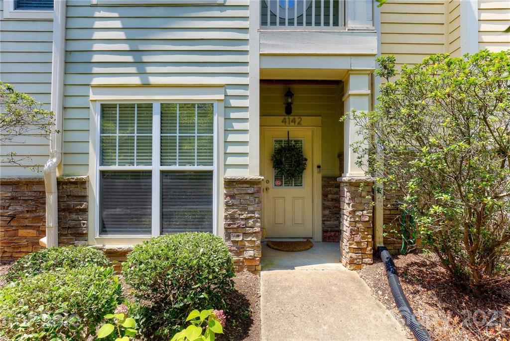 4142 Walker Road Charlotte, NC 28211 - Photo 17 of 18 a view of brick house with a large window