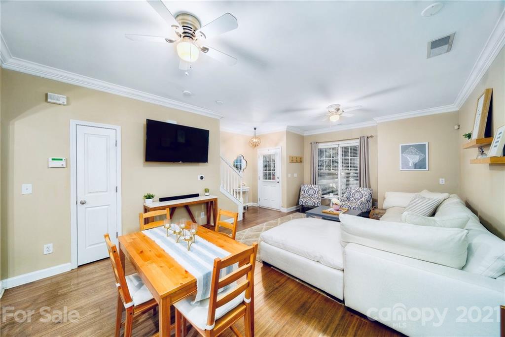 4142 Walker Road Charlotte, NC 28211 - Photo 4 of 18 a living room that has a couch and a flat screen tv