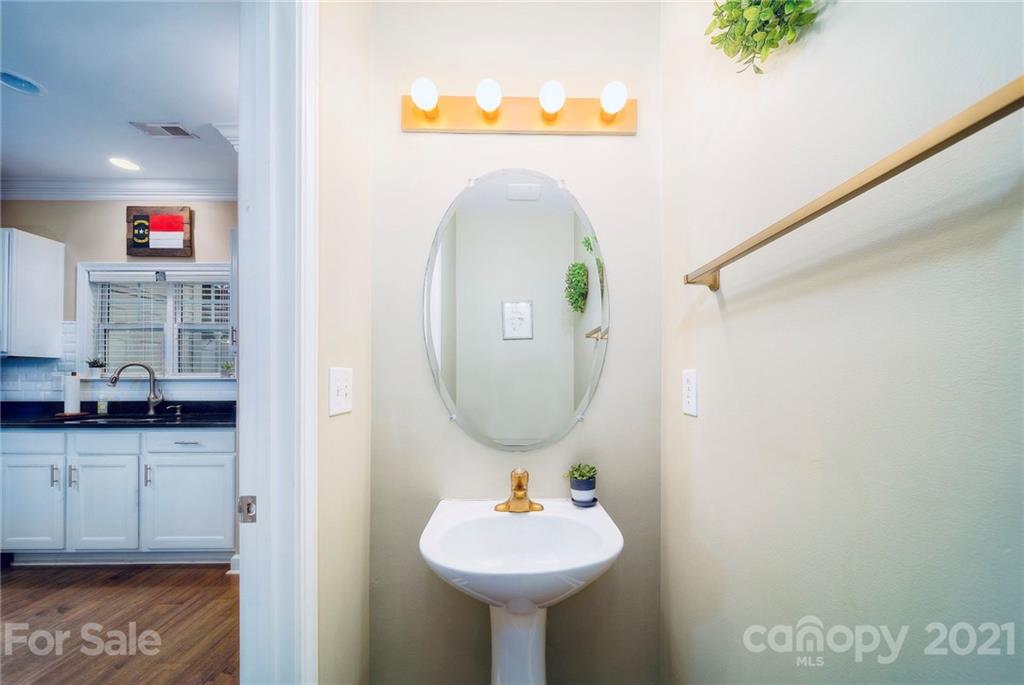 4142 Walker Road Charlotte, NC 28211 - Photo 5 of 18 a bathroom with a sink and a mirror
