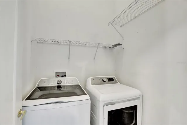 a utility room with dryer and washer