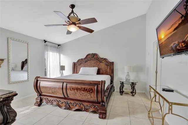 a bedroom with furniture and a window