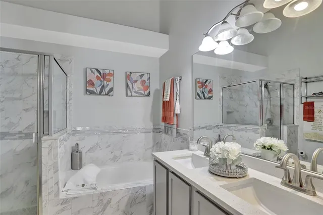 a bathroom with a sink mirror and vanity
