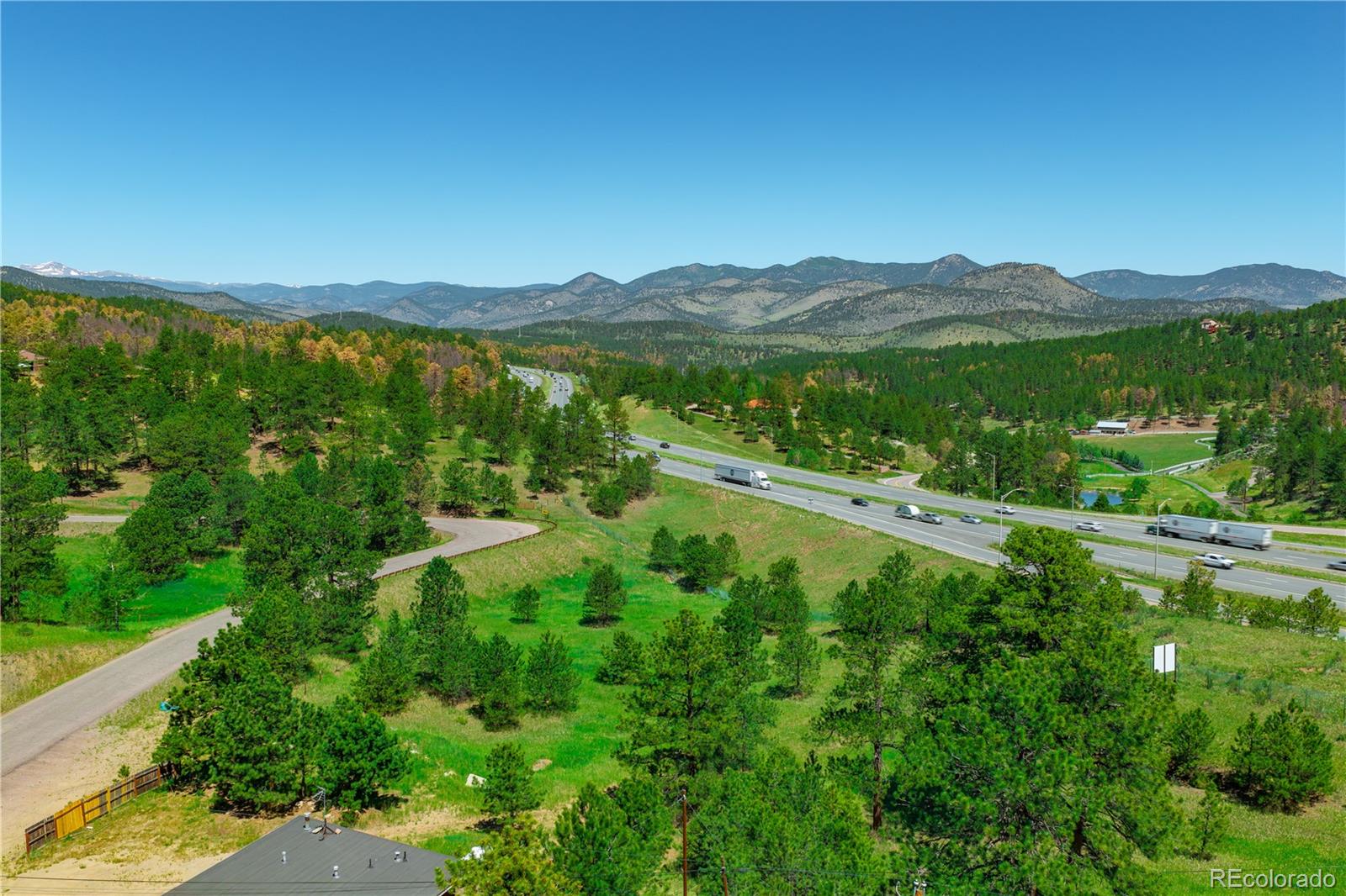 29793 Ruby Ranch Road Evergreen, CO 80439 - Photo 11 of 28 a view of lake with mountain