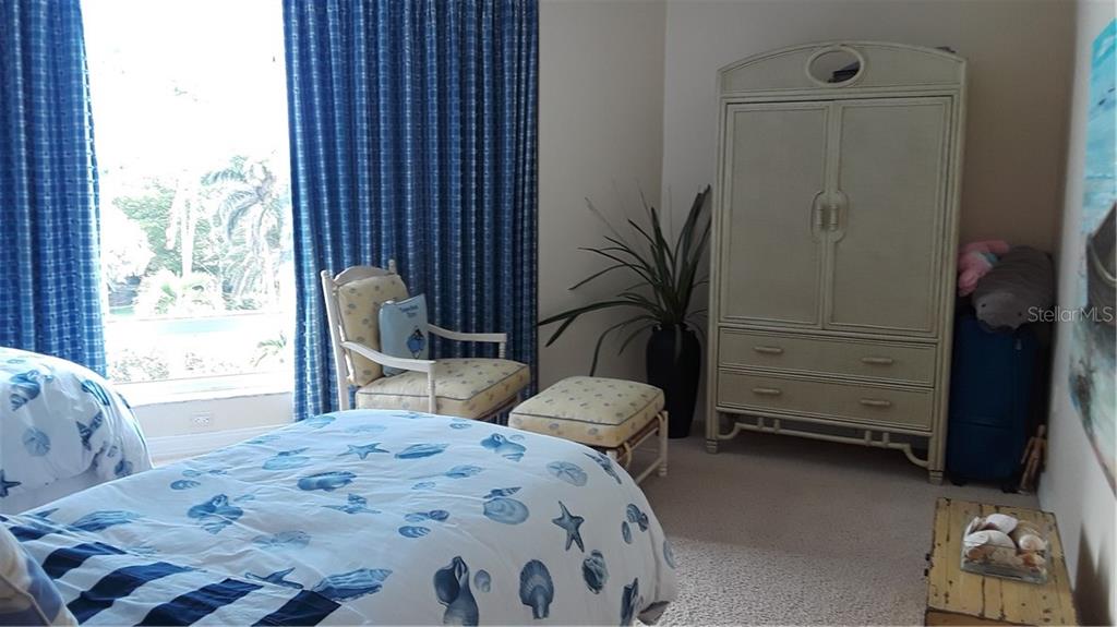 455 Longboat Club Road, Unit 401 Longboat Key, FL 34228 - Photo 20 of 28 a bedroom with a bed and a window