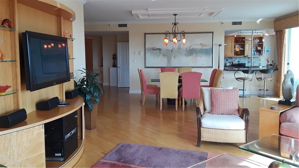 455 Longboat Club Road, Unit 401 Longboat Key, FL 34228 - Photo 5 of 28 a dining room with furniture and window