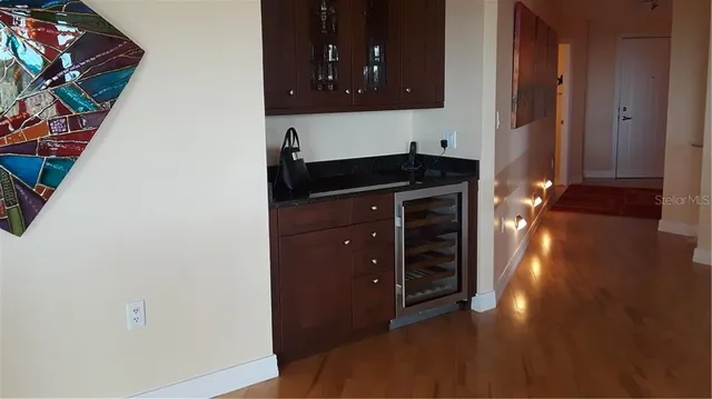 a view of a living room with hardwood floor