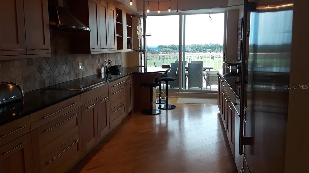 455 Longboat Club Road, Unit 401 Longboat Key, FL 34228 - Photo 9 of 28 a kitchen with lots of counter top space