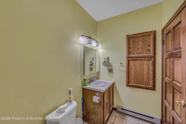 a view of a livingroom with furniture and an empty room
