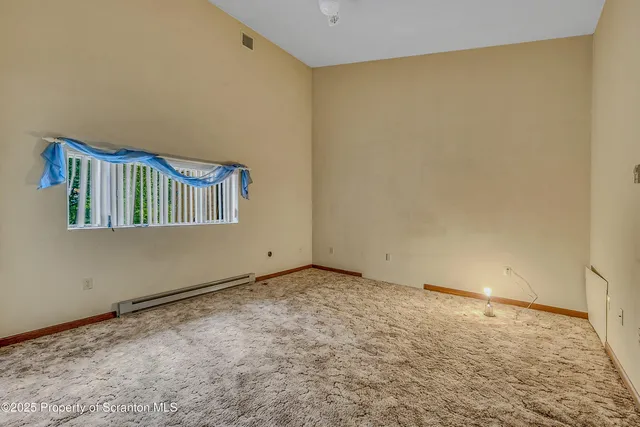 a kitchen with a sink cabinets and window