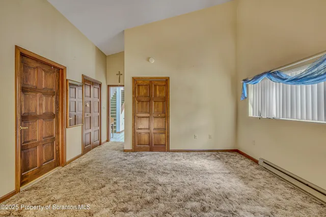 a large kitchen with stainless steel appliances lots of counter space and wooden floor