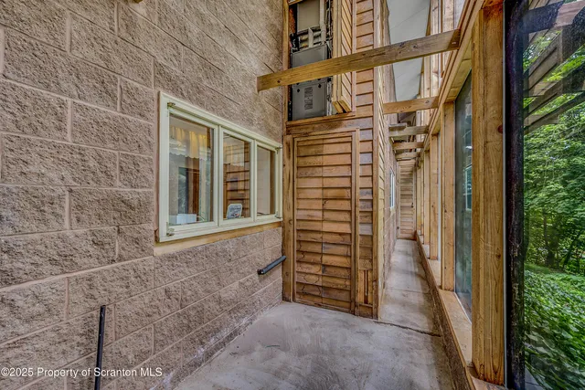a view of a livingroom with furniture and a window