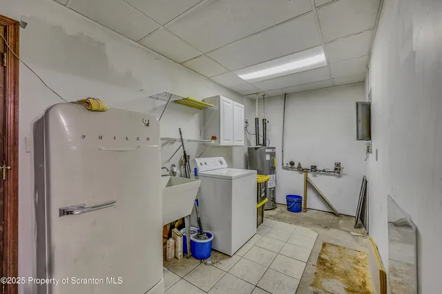 a bathroom with a toilet a sink and a mirror